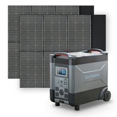 two portable generators are next to each other in front of a wall of solar panels