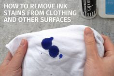 someone is removing ink stains from clothing and other surfaces