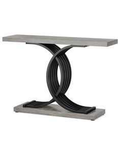 a modern console table with black and grey metal accents on the base, against a white background