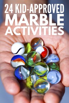 a person holding marbles in their hands with the text, 24 kid - approved marble activities