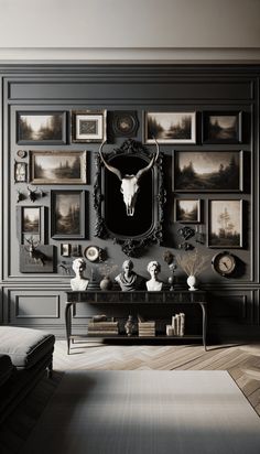 a living room with pictures on the wall and an animal skull mounted to the wall