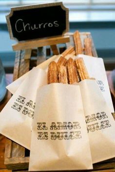 an image of some food on a table with the caption'churros '