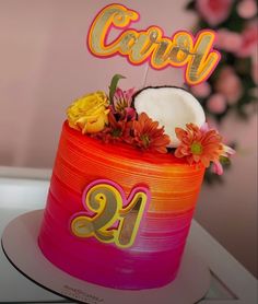 a colorful cake with flowers and candles on top that says cool twenty two - tiered cake