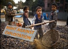 children are standing on the rocks with a large metal basket in front of them that says right against explanation