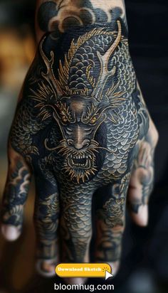 a person's hand with tattoos on it and a dragon tattooed on the palm