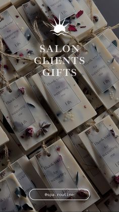 some soaps with flowers on them and the words salon client's gifts written in white