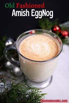 an old fashioned eggnog in a glass mug