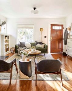 a living room filled with furniture and a fire place