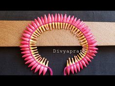 the pink and gold bracelet is made out of pencils