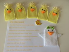 five little ducks sitting on top of a piece of paper next to a note with the words five little ducks written in it