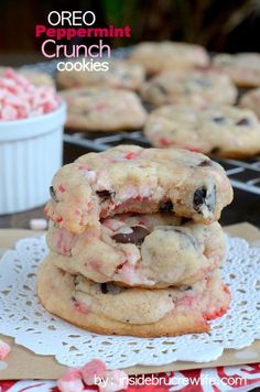 three cookies stacked on top of each other with pink and white sprinkles