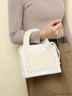 BagForLove - Compact Faux Pearl Satchel Bag with Inner Pouch and Drawstring Closure Product Description Color Beige Details Pearls Type Square Bag Strap Type Double Handle Pattern Type Plain Style Fashionable Material PMMA Size Chart INCH CM Bag Length Bag Width Bag Height Handle Height 7.9/7.9 inch 3.9/0.1 inch 6.3/6.3 inch 3.1 inch Bag Length Bag Width Bag Height Handle Height 20/20 cm 10/0.2 cm 16/16 cm 8 cm Details Pictures Similar Products h2 { text-align: center; } /* æ¢è¡ */ li{ white-s Trendy White Plastic Bags, Casual White Plastic Bags, Spring Rectangular Shoulder Bag With Pearl Handle, White Travel Bag With Pearl Handle, Rectangular Plastic Bag With Adjustable Strap, Spring Rectangular Bag With Pearl Handle, Plastic Shoulder Bag, Plastic Satchel Shoulder Bag, Summer Square Bag With Pearl Handle