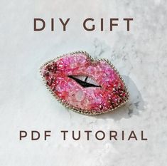 a pink brooch with the words diy gift on it and an image of a woman's lips