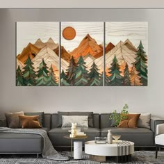 three pieces of artwork on the wall in a living room with couches and coffee table