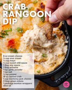 a hand dipping a tortilla chip into a bowl of crab rangoon dip