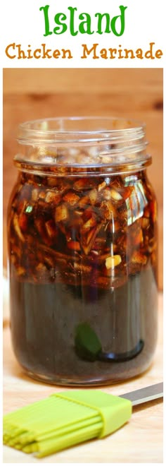 a jar filled with chicken marinade next to a knife