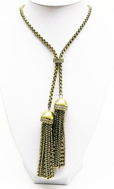 Finished in  Antique  gold  tone, signed, Gold Dangle Lariat Necklace For Parties, Gold Fringe Necklace For Party, Metal Lariat Tassel Necklace With Adjustable Chain, Adjustable Metal Lariat Tassel Necklace, Gold Long Drop Tassel Jewelry, Elegant Gold Necklace With Tassels, Gold Brass Lariat Necklace, Adjustable Lariat Jewelry With Tassels, Adjustable Lariat Necklace With Tassels For Party