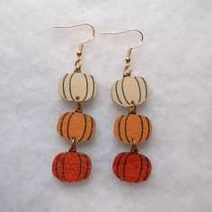 ~Fun Triple Pumpkin Stack Wood Dangle Earrings ~Cream Pumpkin, Orange & Red Orange Pumpkins ~Gold Fish Hook Style ~Measurements: 2" X 3/4" ~Happy Fall To All ~ General Cleaning Instructions: Wipe With A Damp Cloth, Dry With A Soft Cloth. Do Not Immerse In Water Or Jewelry Cleaner. ~Thank You For Your Interest In This Item ~Please Shop All My Closet Items ~Follow Me For Future Finds ~Quality New & Pre-Owned Items Fun Orange Halloween Earrings, Fun Orange Earrings For Halloween, Pumpkin Stack, Thanksgiving Jewelry, Amanda Lee, General Cleaning, Thanksgiving Color, Wood Dangle Earrings, Stacked Pumpkins