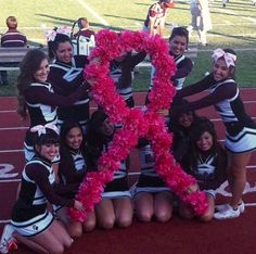 the cheerleaders are posing for a photo with their letter k in front of them