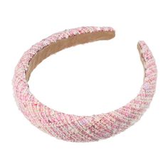 a pink and white headband on a white background