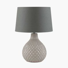 a white table lamp with a grey shade