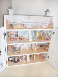 a doll house with all the furniture and accessories