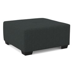 a black footstool sitting on top of a white floor