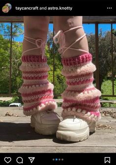 the legs and ankles of a woman wearing boots with crocheted socks