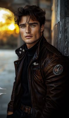 a man in a leather jacket leaning against a wall