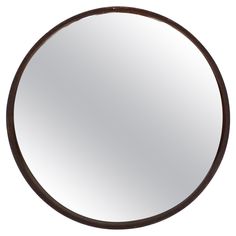 a round mirror on a white background