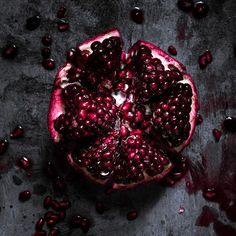 the pomegranate is cut in half and ready to be eaten