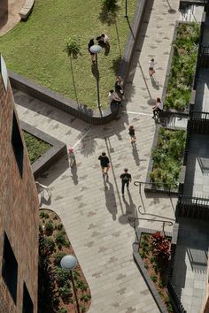 an aerial view of people walking on the sidewalk