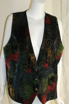 Fabulous velvet waistcoat vest from J.Maclnally's, size 1X....fabulous wild printed velvet...almost looks hand-painted with lux gold-tone metallic detail throughout... 68% Acetate, 20% Nylon, 2% Metal, lined in Acetate, Dry clean only, size 1X....back elastic on the vest... Art-to-wear, absolutely stunning...  MEASUREMENTS:  48-49 inch bust, 14.5 inches across top shoulder, 27.25 inch length (front length), 23 inch back length  Inventory code:MA10-12-BIN330 I am currently listing many fine, unus Funky Vintage Aesthetic, Funky Vest Outfit, Funky Clothes Aesthetic, Twenties Aesthetic, Funky Style Outfits, Vintage Vest Outfit, 1970s Hippie Fashion, Waistcoat Outfit Women, Victorian Vest