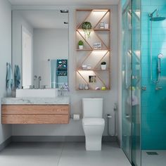 a white toilet sitting next to a walk in shower under a bathroom mirror above a sink