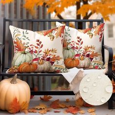 a bench with fall leaves and pumpkins on it