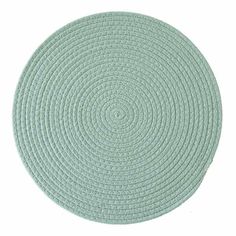 the circular rug is light green and has an intricate design on it's surface