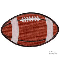 an embroidered football patch with white stitching on it's side and the ball in the center