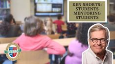 a man with glasses is smiling in front of a classroom full of students and a sign that says ken shorts students'mentoring students