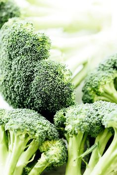 broccoli florets are arranged on a table