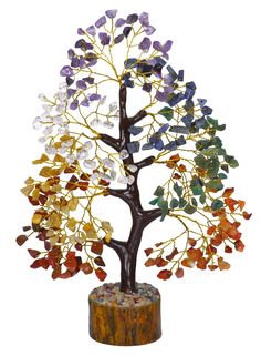 a tree sculpture with multicolored rocks on it's trunk and branches in the shape of a tree