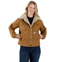 Withstand cold weather in this women's canvas sherpa lined jacket. It's lined with soft sherpa fleece for a warm and comfortable feel. Rugged canvas duck has built-in flex so you can lift and stretch without restriction. A loose fit gives you plenty of room to move. Features8.5-ounce, 98% cotton/2% elastane canvasSherpa liningBuilt to move with Rugged Flex® stretch technologyModifiable mock-neck secured tab collarAdjustable cuffs and hemSecure interior and exterior pocketsBack length: 24.25"Mode Sherpa Lined Jacket, Cold Weather Gear, Carhartt Womens, Safety Clothing, Classic Jacket, Line Jackets, Sherpa Lined, Outdoor Wear, Sherpa Fleece