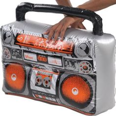 a person is holding an inflatable boombox