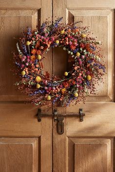 a wreath is hanging on the front door