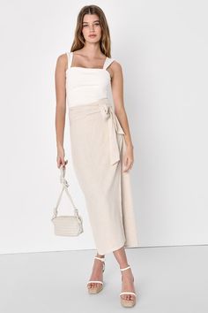 An easygoing babe like you needs the Lulus Breezy Personality Beige Linen Midi Wrap Skirt in your wardrobe this season! This easy-breezy skirt has a lightweight, linen-blend composition that shapes a high banded waist with a sash tying detail that secures above the trendy wrap silhouette. Chic midi hem creates the perfect moment to show off your favorite strappy sandals! Fit: This garment fits true to size. Length: Ankle length. Size medium measures 31.25" from waist to hem. Waist: Fitted - very Beige Linen Midi Skirt Outfit, Tan Linen Skirt Outfit, Beige Linen Skirt Outfit, Linen Skirt Outfit Summer, Summer Midi Skirt Outfits, Midi Wrap Skirt Outfit, Linen Skirt Outfit, Beige Skirt Outfit, Wrap Skirt Outfit