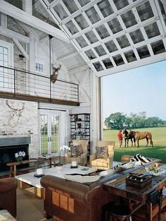 a living room filled with furniture and a fire place