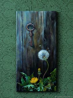 a painting of a dandelion and a key on a wooden paneled wall