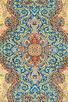 an intricately designed carpet with blue, yellow and red colors stock photo - 1309782