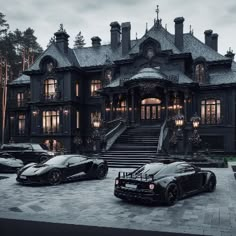 two black sports cars parked in front of a large house with stairs leading up to it