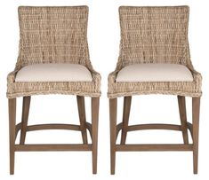 pair of wicker bar stools with beige upholstered back and seat cushions