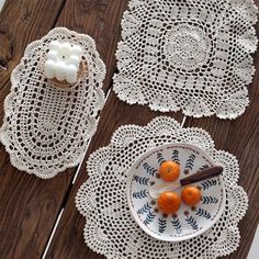 crocheted doily and oranges on a wooden table